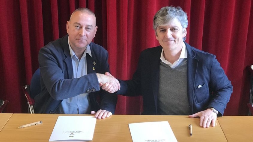 Robert Mundet i Joan Puig, en l'acte de signatura del conveni